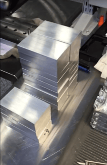 Stacked raw parts ready to be placed in a CNC machine