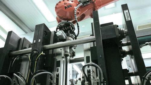 Industrial robot manufacturing a road bike carbon frame
