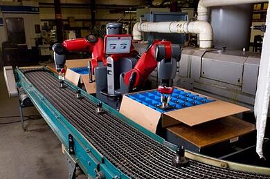 Baxter collaborative robot placing parts on a conveyor