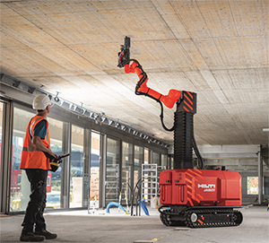 Robot drilling anchor holes on a ceiling.