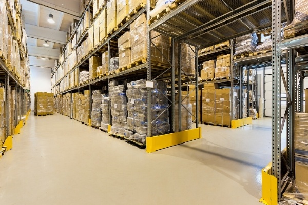 Interior of a huge spacious warehouse with carton boxes-822506-edited.jpeg