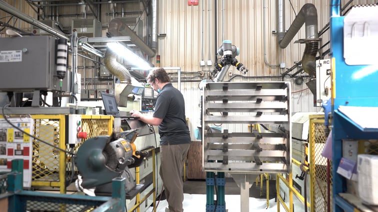 Intern working near a collaborative robot