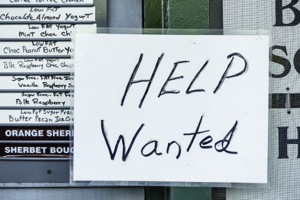 Laminated handwritten "Help Wanted" sign in window of ice cream and yogurt shop in tourist town-979060-edited.jpeg
