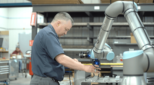 CNC Operator with a machine tending cobot