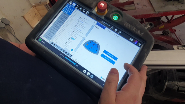 Universal robots teach pendant showing the robotiq sanding and polishing software