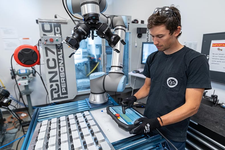 Person Working on Cobot - CNC Machine Tending Kit