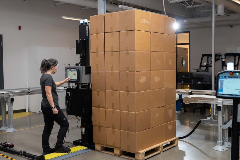 Operator near a robotic palletizing system