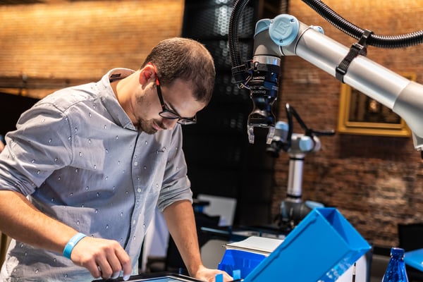 Robotiq engineer working with a cobot