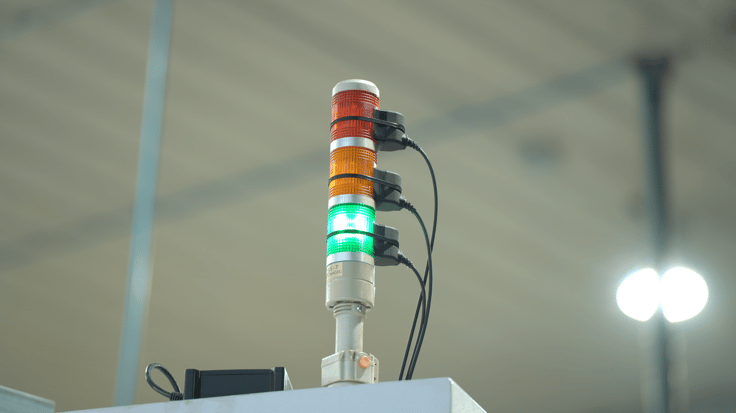 Machine Tending Solution including a stack light sensor to detect machine's status