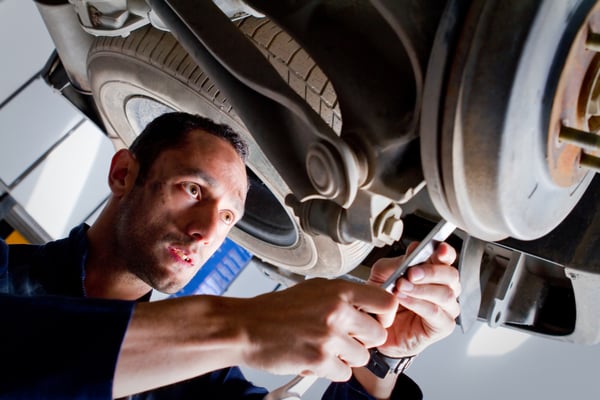 Mechanic fixing a car at the garage