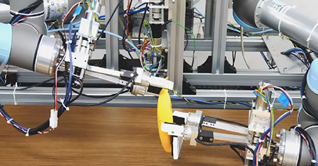 Robots being used to peel a banana
