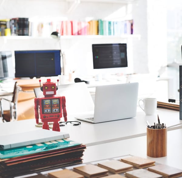 Robot-on-a-desk-next-to-a-laptop